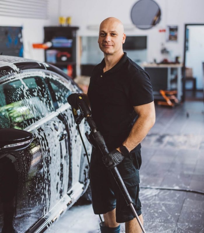 service-man-washing-car-before-detailing-in-workshop-.jpg